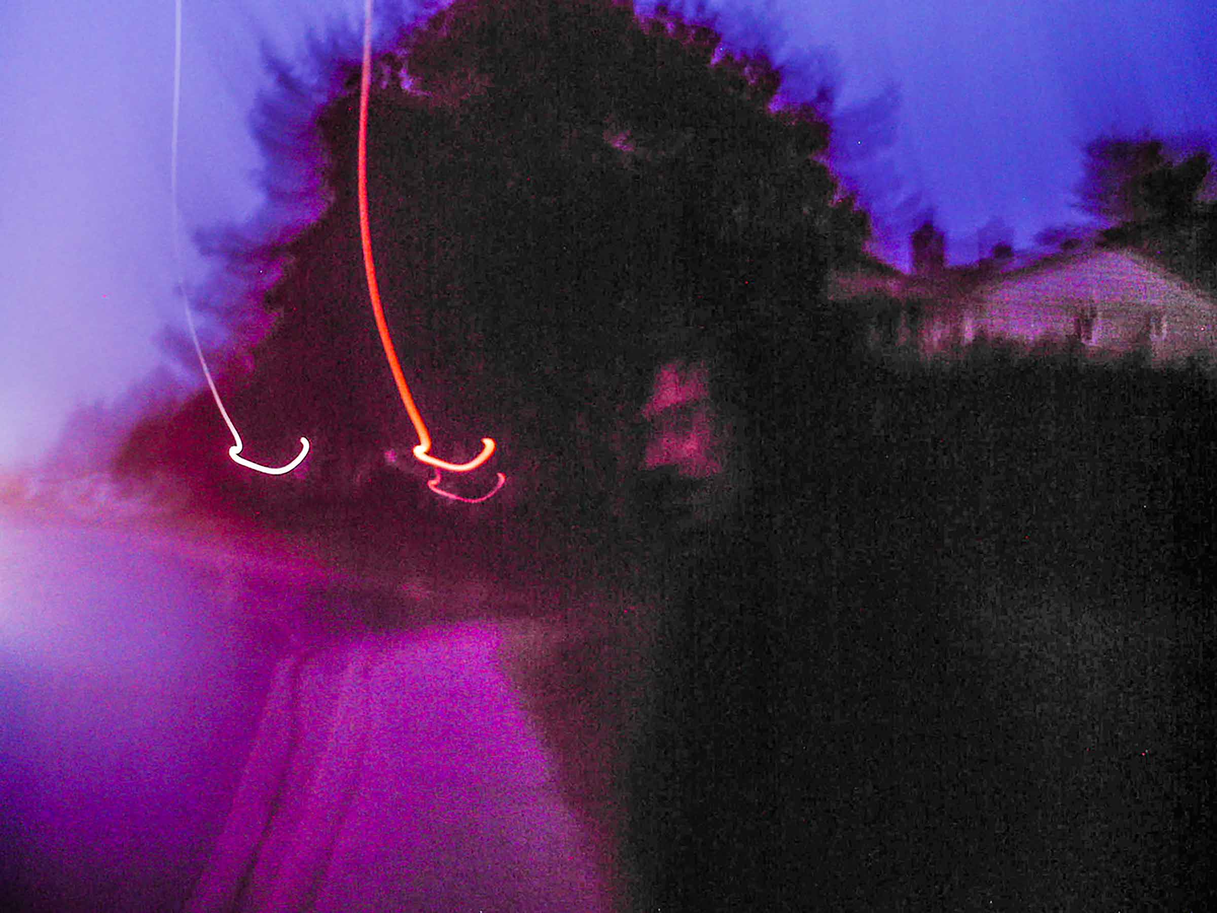Lo-fi polaroid photograph of person on a sidewalk